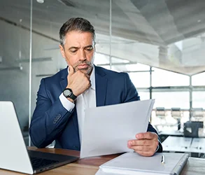 Man in suit at desk